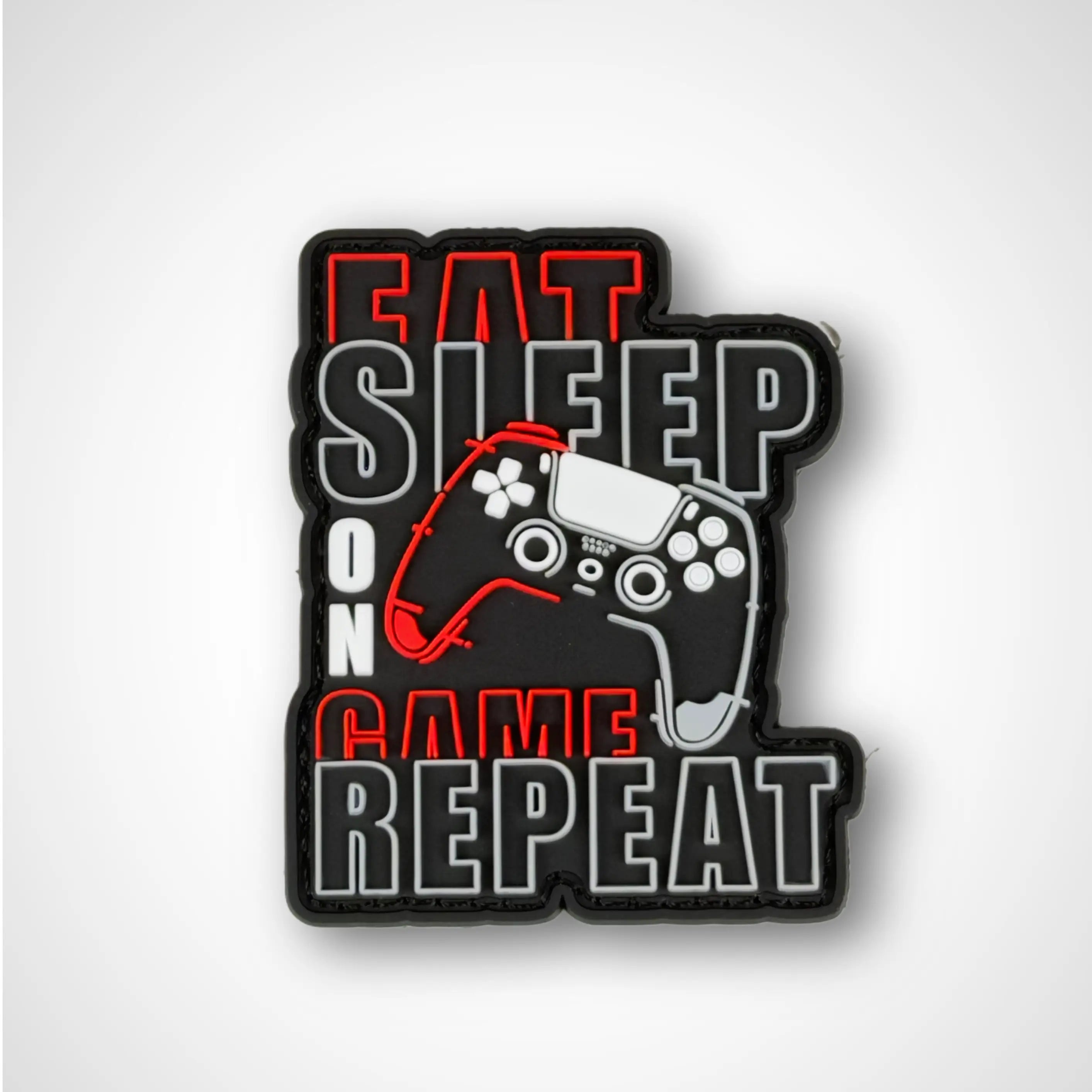 Gaming-themed patch with controller illustration and text 'Eat Sleep On Game Repeat' on a white background